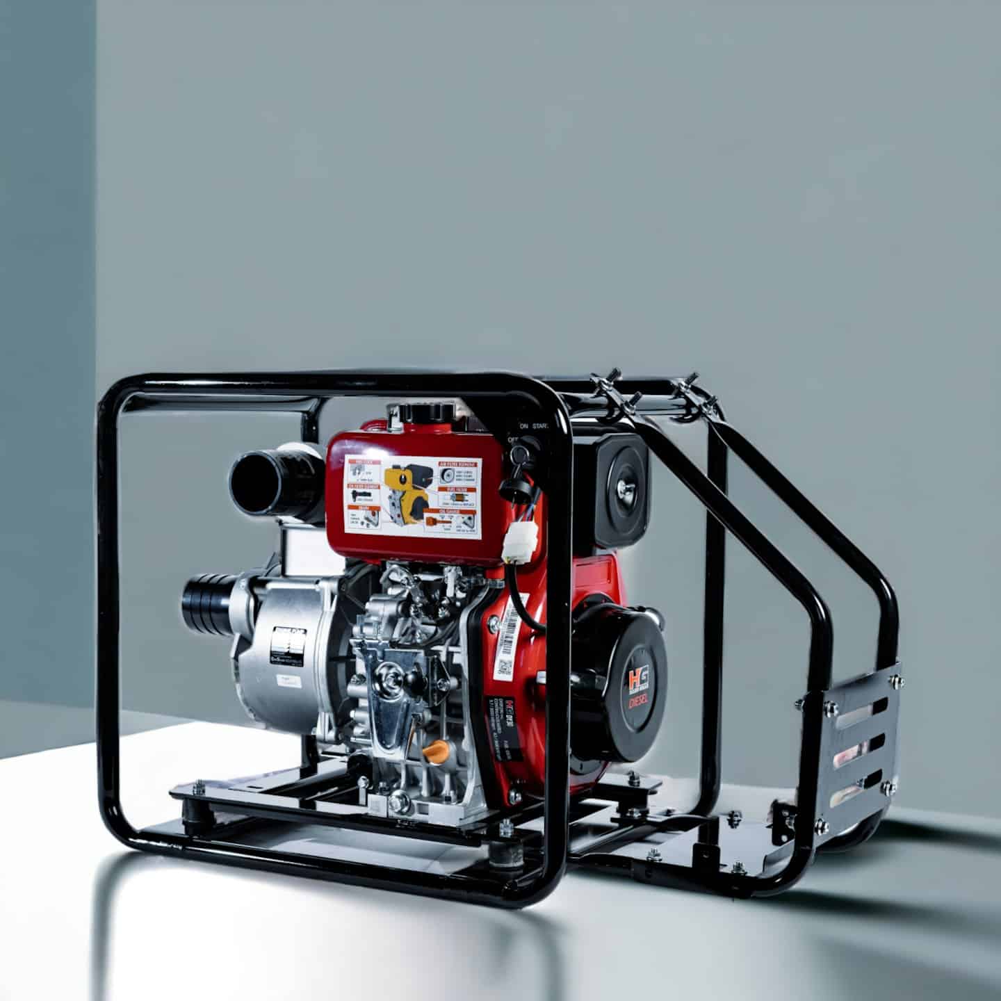 A red and silver diesel water pump sits inside a protective frame.